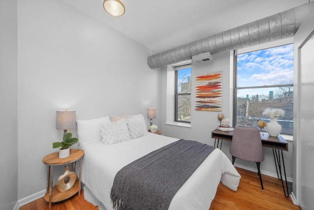 bedroom featuring hardwood / wood-style floors