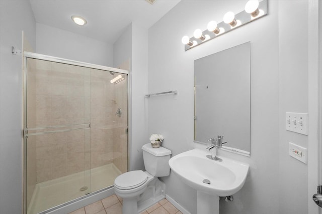 bathroom featuring sink, an enclosed shower, tile patterned floors, and toilet