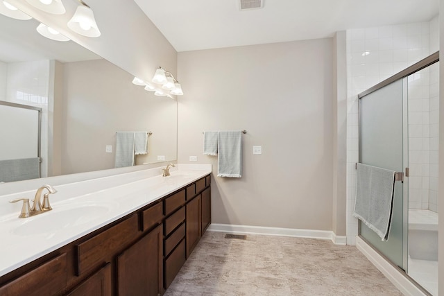 bathroom with an enclosed shower and vanity