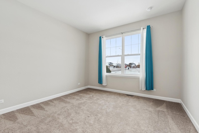 empty room with carpet flooring