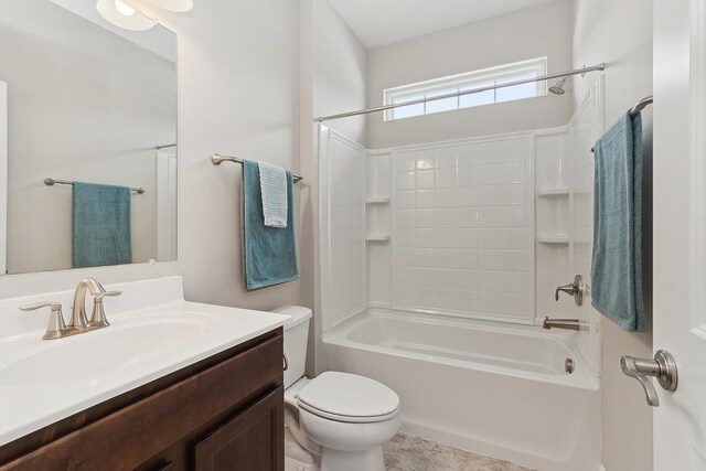 full bathroom with toilet, vanity, and  shower combination