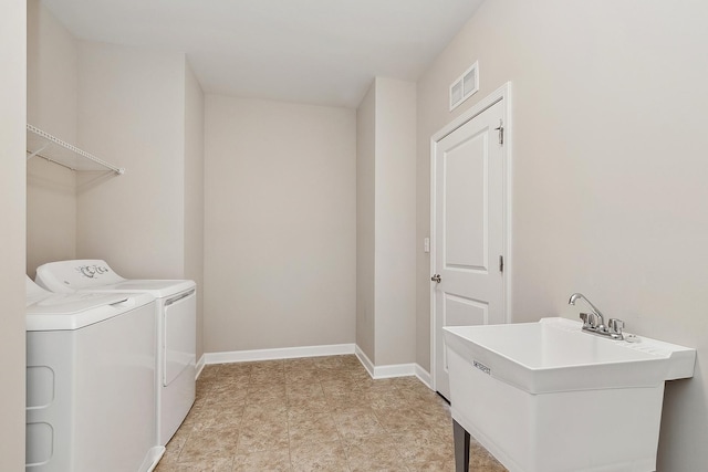 laundry room featuring sink and washing machine and dryer