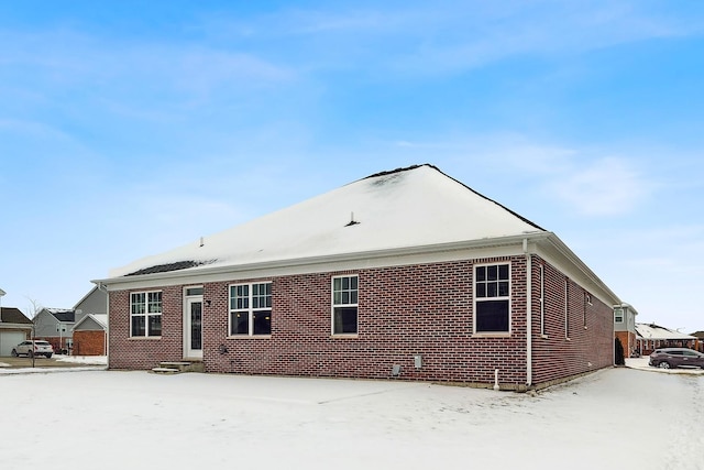 view of snow covered house