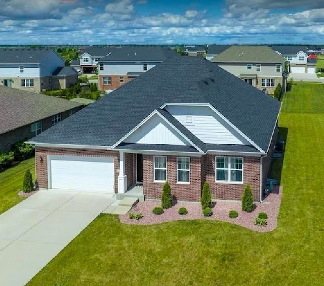 view of front of house with a front lawn and a garage