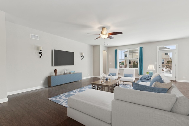 living room with ceiling fan and dark hardwood / wood-style floors