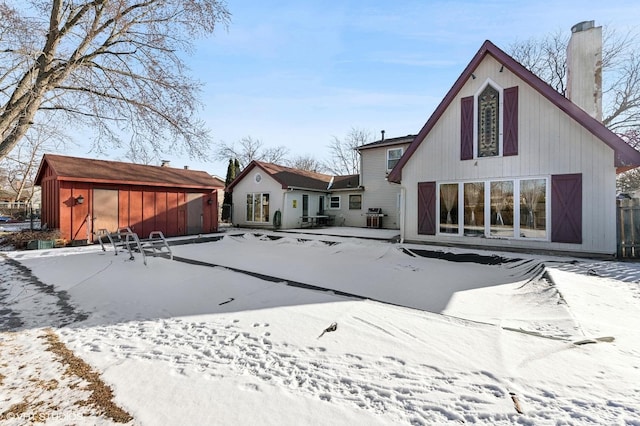 view of snow covered house