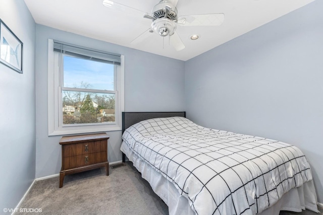 bedroom with light carpet and ceiling fan