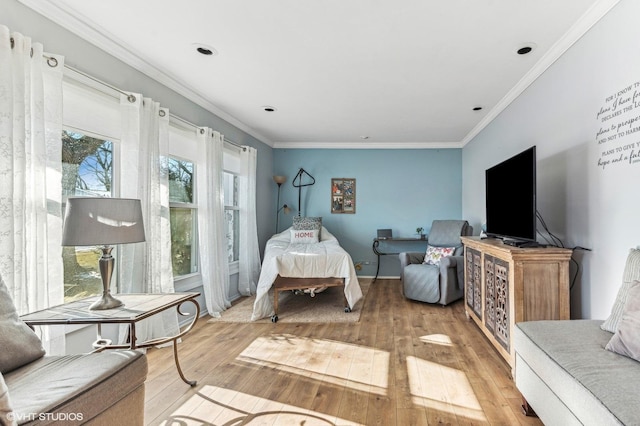 bedroom featuring hardwood / wood-style floors and ornamental molding