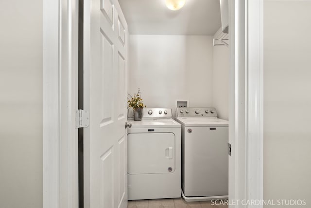 clothes washing area featuring washing machine and dryer