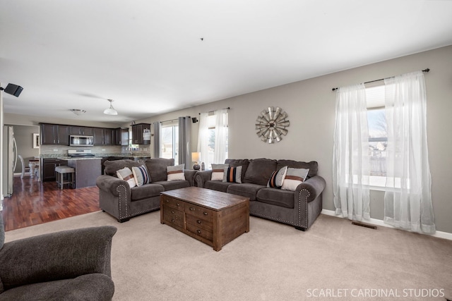 living room featuring light colored carpet