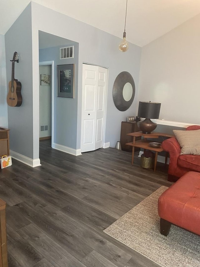 living room featuring dark wood-type flooring