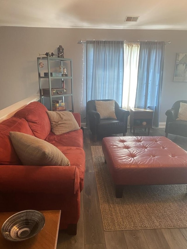 living room with dark hardwood / wood-style floors