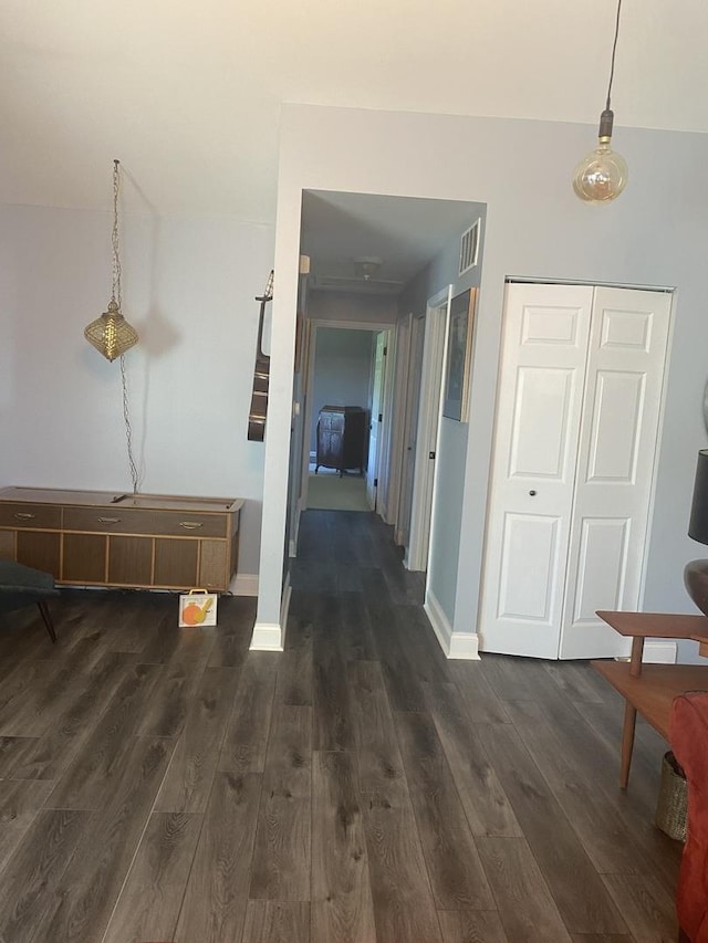 corridor with dark wood-type flooring