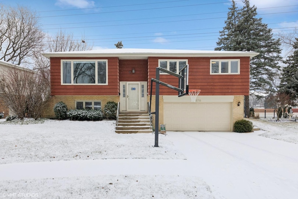 split foyer home featuring a garage