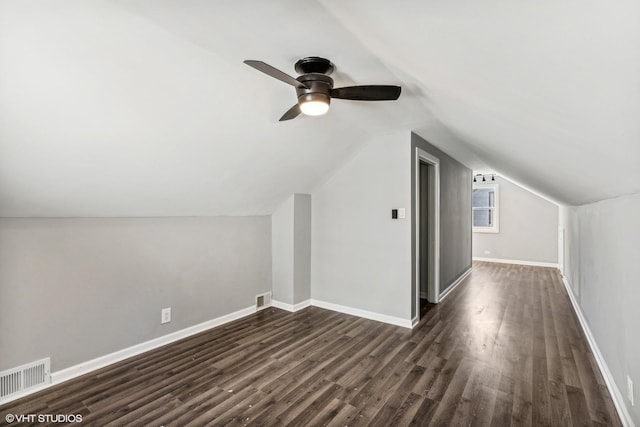 bonus room featuring lofted ceiling, ceiling fan, and dark wood-type flooring