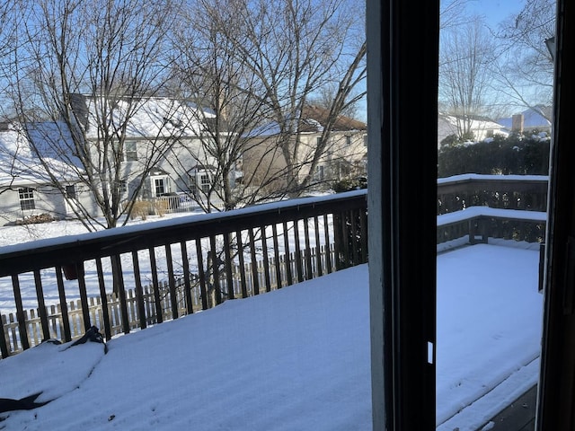 view of snow covered deck