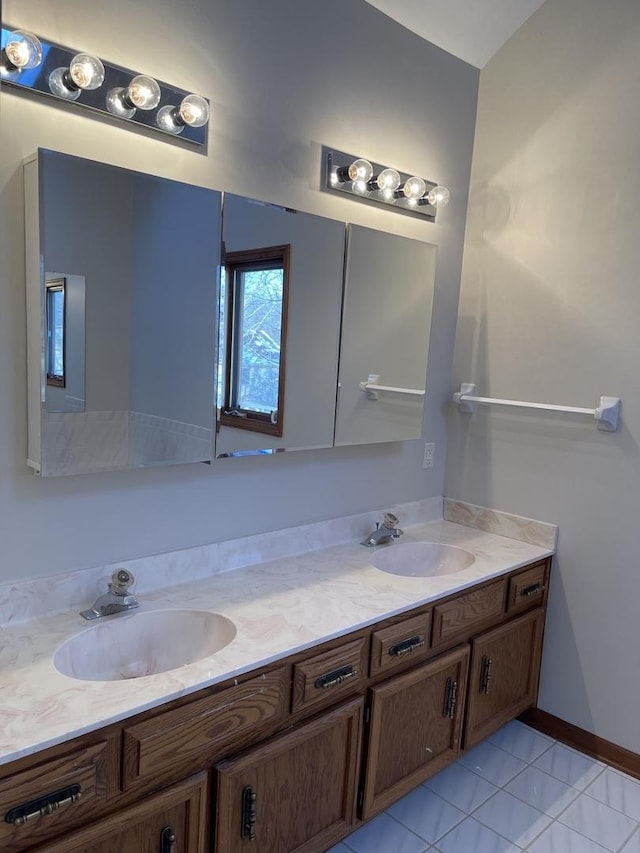 bathroom with vanity and tile patterned floors