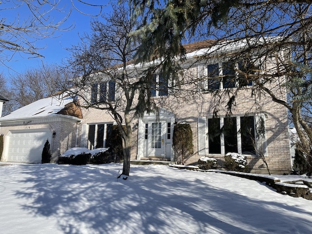 colonial inspired home with a garage