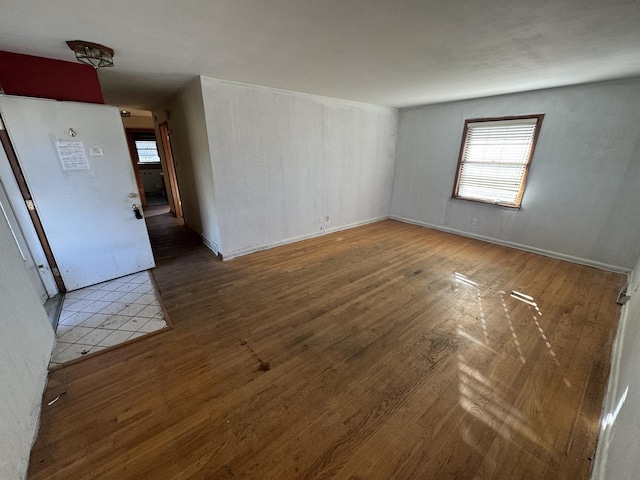 empty room with wood-type flooring