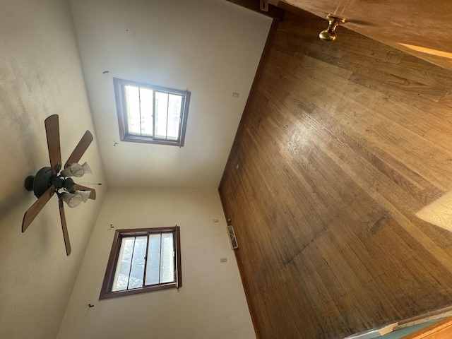 additional living space with ceiling fan and plenty of natural light