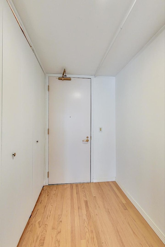 empty room with light hardwood / wood-style floors