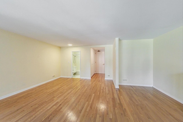 spare room featuring light hardwood / wood-style floors