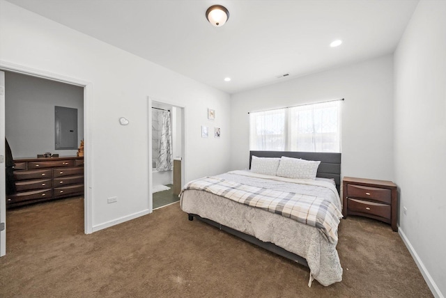 carpeted bedroom featuring ensuite bath