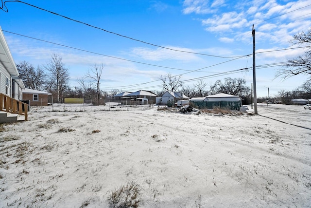 view of yard layered in snow