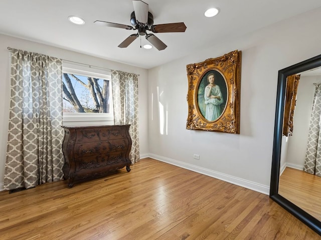 sitting room featuring ceiling fan and light hardwood / wood-style flooring