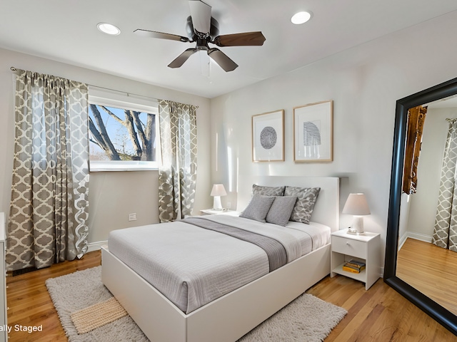 bedroom featuring ceiling fan and wood-type flooring