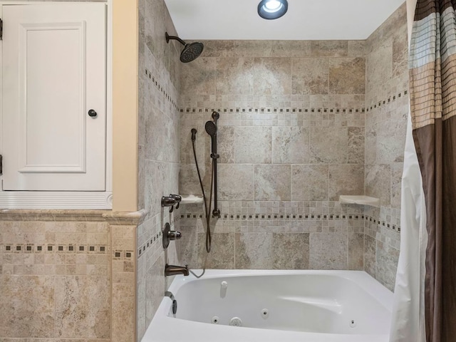 bathroom featuring tile walls and shower / tub combo with curtain