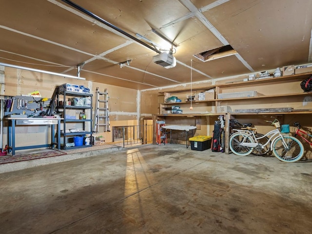 garage featuring a workshop area and a garage door opener