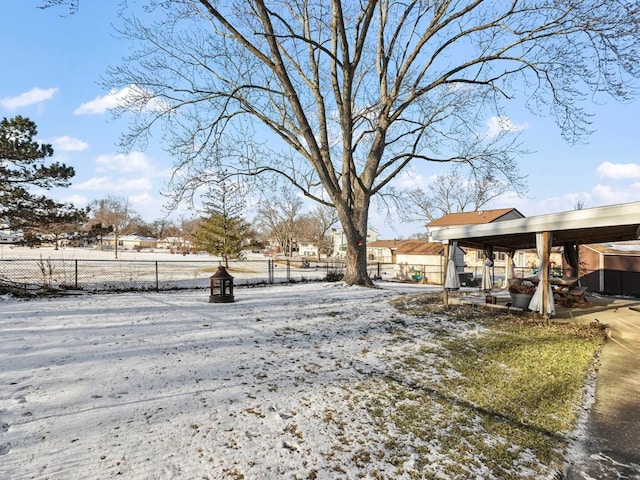 view of yard layered in snow