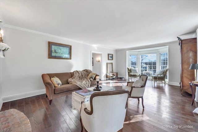 living area with dark wood-style flooring, crown molding, and baseboards