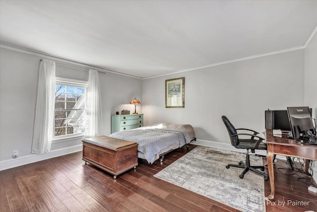 bedroom featuring crown molding, dark wood-style flooring, and baseboards