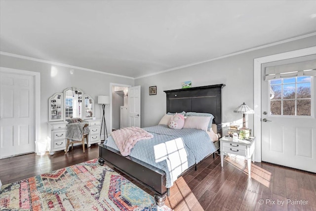 bedroom with hardwood / wood-style flooring and ornamental molding