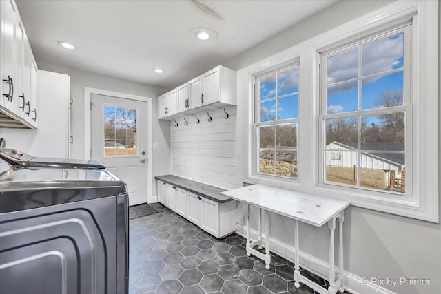 mudroom featuring recessed lighting, dark tile patterned flooring, washer and clothes dryer, and baseboards