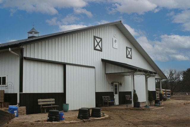 view of side of property with an outbuilding and a pole building