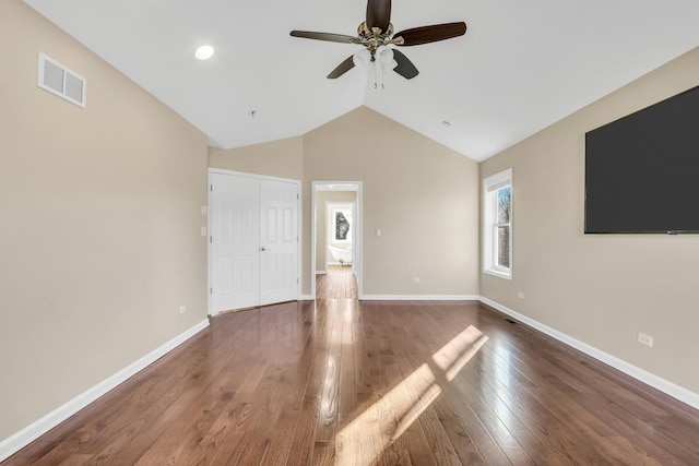 unfurnished living room with ceiling fan, dark hardwood / wood-style flooring, and lofted ceiling