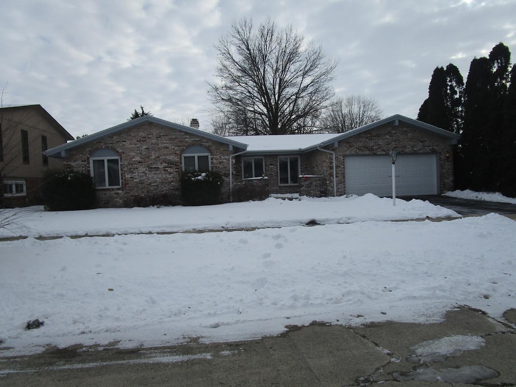 single story home with a garage