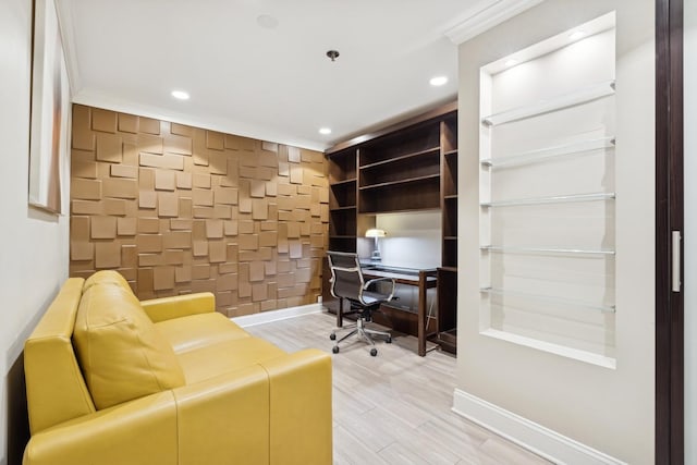 home office with crown molding and hardwood / wood-style flooring