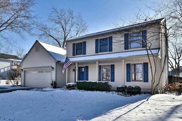 front of property featuring covered porch and a garage