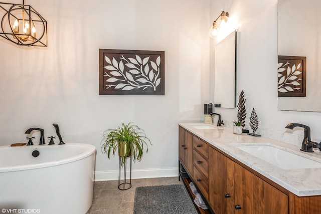 bathroom with vanity and a tub