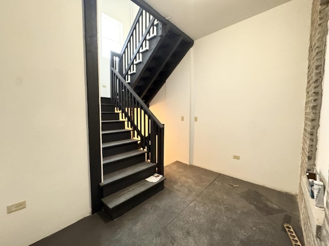 stairs with concrete floors