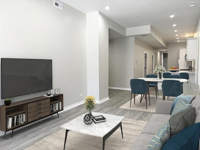 living room with light wood-type flooring