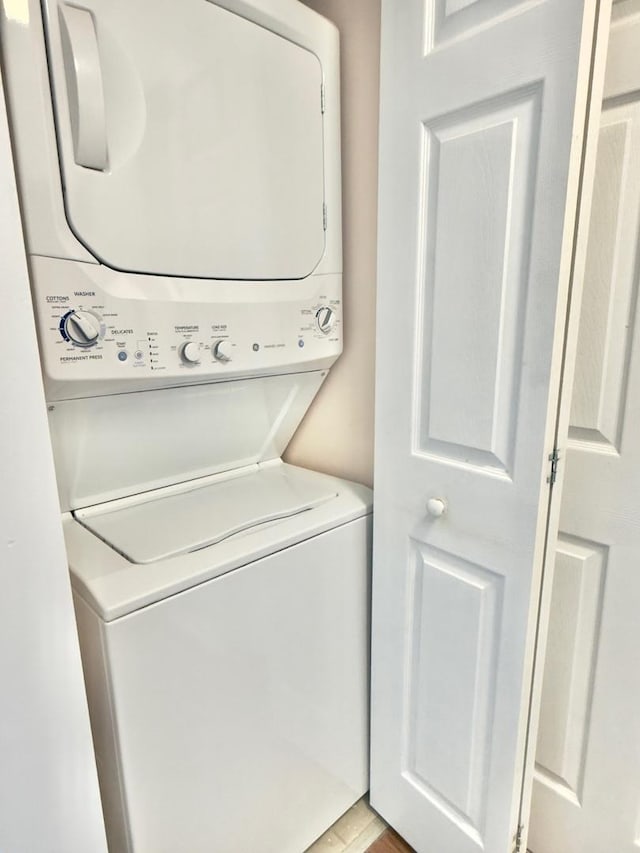 laundry room featuring stacked washer and clothes dryer