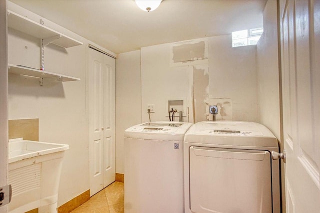 washroom featuring washer and clothes dryer and sink