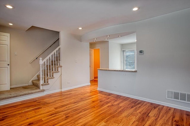 unfurnished living room featuring light hardwood / wood-style floors