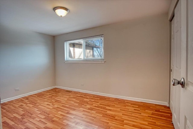 spare room with light hardwood / wood-style floors