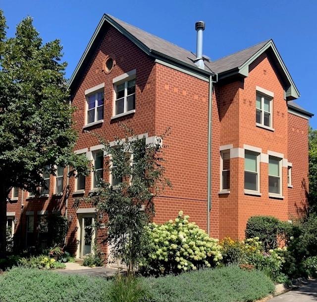 view of side of home featuring brick siding